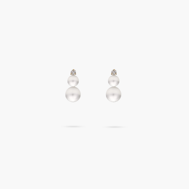 Pair of pearl earrings on a white background